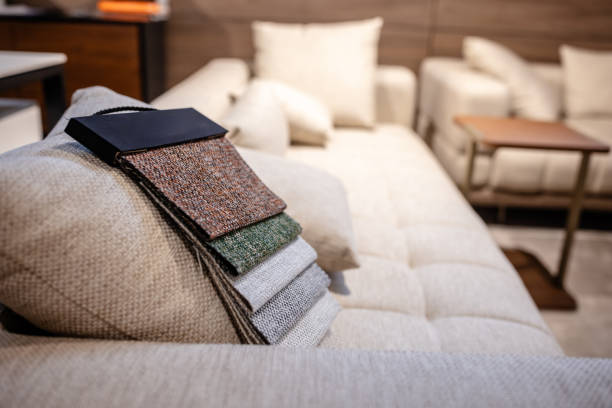 An image capturing a range of fabric textures and colors laid out on a couch, providing inspiration and options for interior design and home styling.